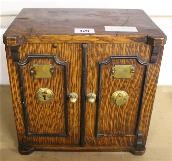 An oak humidor modelled as a safe